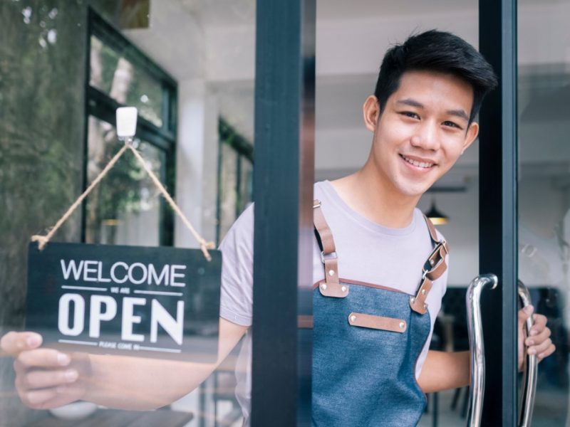 young-startup-coffee-cafe-owner-open-and-welcome-customer-new-small-business-owner_t20_XxBw2G